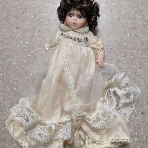Elegant Cream Doll with Brown Hair